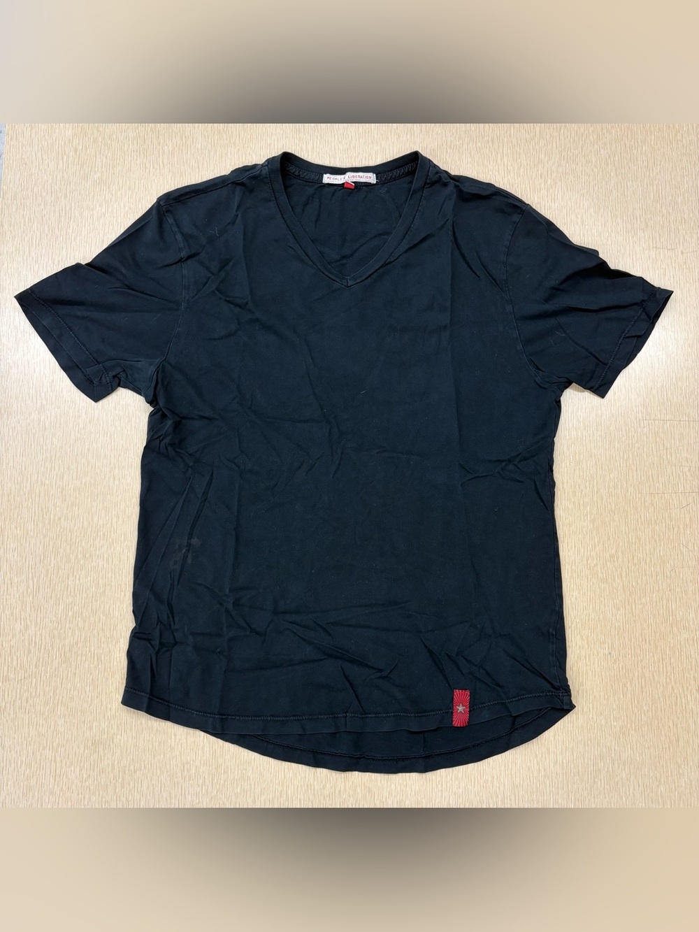 Y2K People’s Liberation black v-neck tee